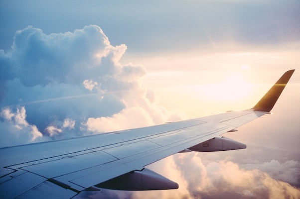 A wing of a plane during flight